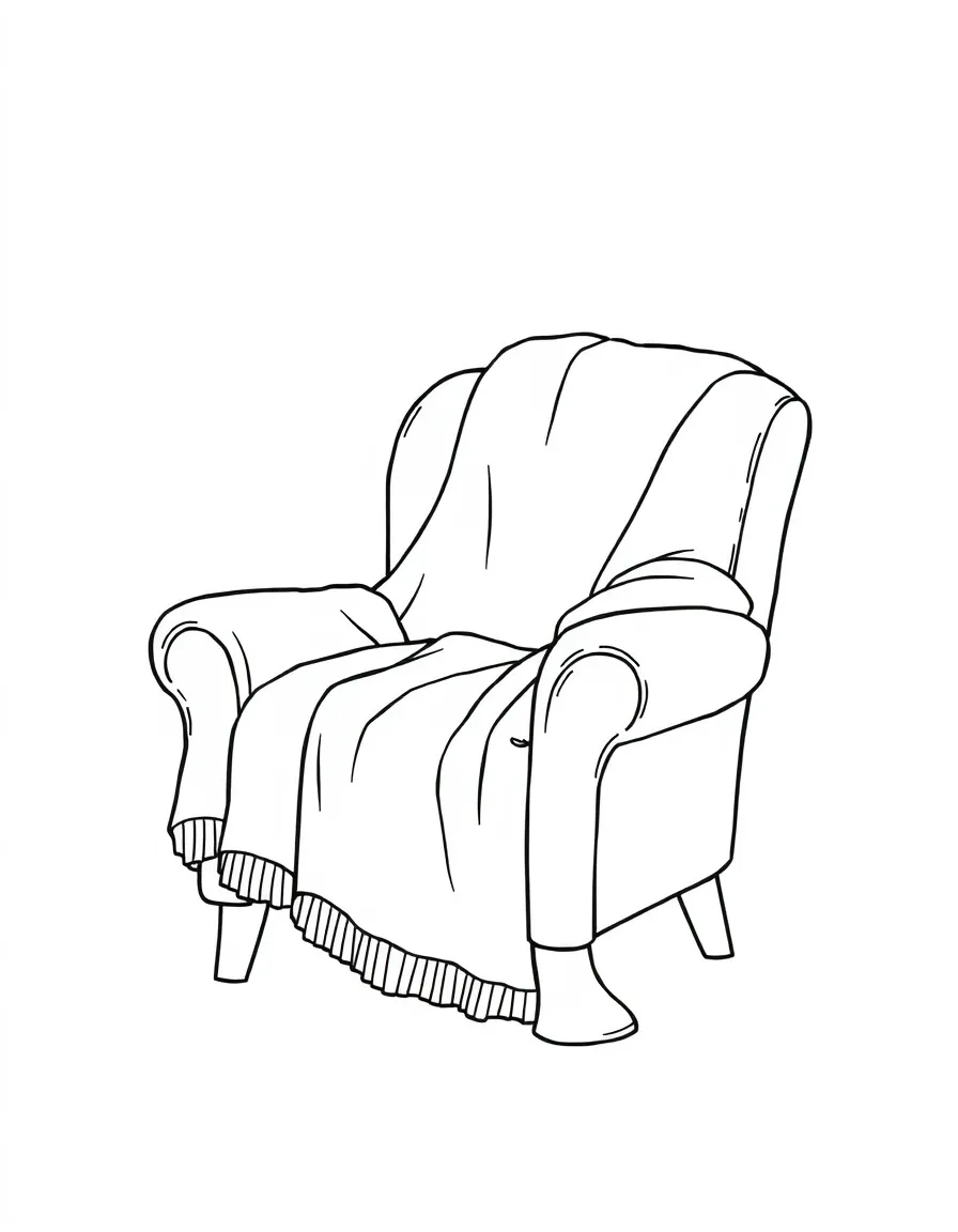 A cozy chair covered in a warm throw.
